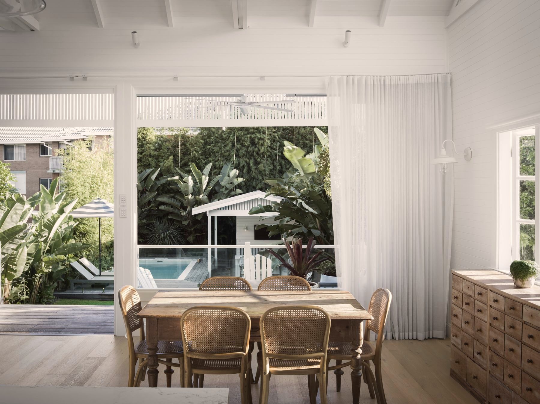 Dining area beside large garden windows